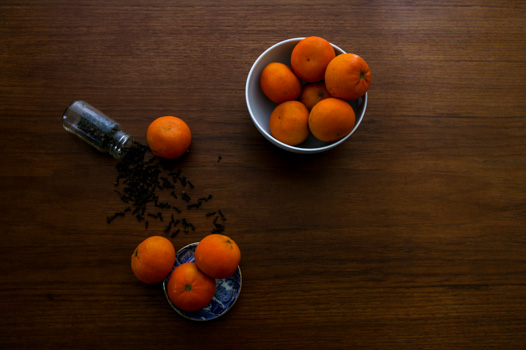 cloves and tangerines on a table